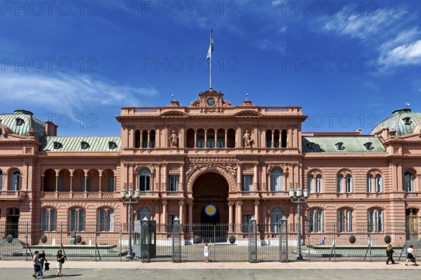 Frontal view of a large historic building with blue sky, famous Argentine landmark, The Presidential Palace Casa Rosada in Buenos Aires Argentina