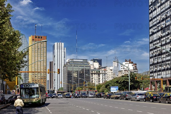 A busy street in a city with many skyscrapers and heavy traffic under a clear sky, The city of Buenos Aires in Argentina