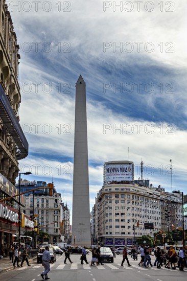 A lively urban square with a tall obelisk in the centre and surrounding buildings, The Great Obelisk in the city of Buenos Aires Argentina