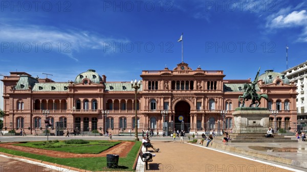 Historic building with equestrian monument and blue sky in the background, famous landmark in Buenos Aires, The presidential palace Casa Rosada in Buenos Aires Argentina