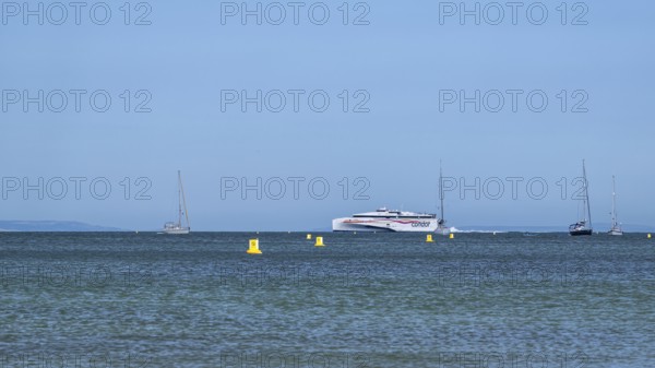 Boats on sea over Knoll Beach Studland, Poole, Dorset, England, United Kingdom