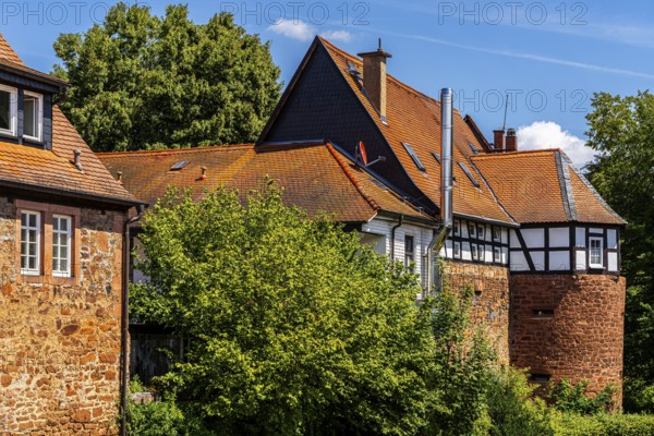 The old town centre with half-timbered houses, church towers and remains of the town wall in Büdingen, Hesse, Germany