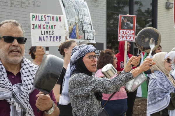 Detroit, Michigan USA - 26 July 2025 - Protesters rally at Eastern Market, banging empty pots to protest starvation in Gaza