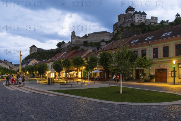 Night shot of the Peace Square in the historic centre of Trencín, Trencín Castle in the background, Capital of Culture 2026, Trencín, Slovakia