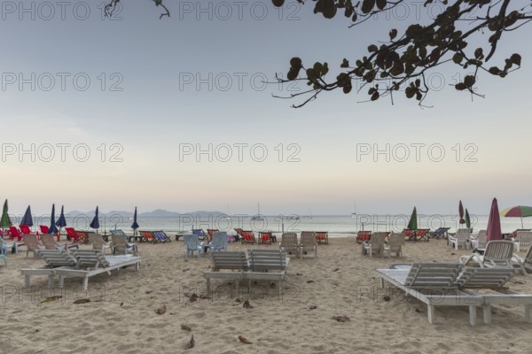 Abandoned deckchairs and parasol after sunset at Charlie Beach, Koh Mook Island, Andaman Sea, Thailand, Southeast Asia