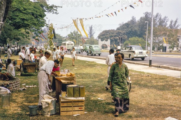 People celebrating having picnics, Waterfront, Johor Bahru, Malaysia, Southeast Asia 1963 - Mawlid festival commemorating the birthday of Islamic prophet Muhammad