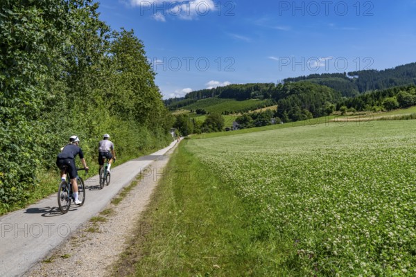 Sauerlandring cycle path, an 84 km long circular cycle path between the towns of Finnentrop, Eslohe, Schmallenberg and Lennestadt, mostly on former railway lines, here near Finnentrop-Serkenrode, Sauerland, North Rhine-Westphalia, Germany