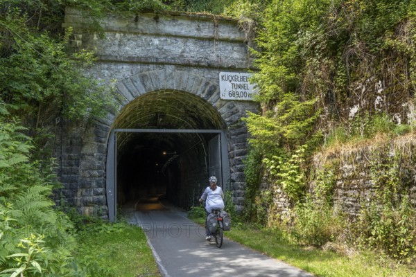 Sauerlandring cycle path, an 84 km long circular cycle path between the towns of Finnentrop, Eslohe, Schmallenberg and Lennestadt, mostly on former railway lines, Kückelheim Tunnel, 689 metres long, bat tunnel, winter quarters for bats, near Finnentrop, Sauerland, North Rhine-Westphalia, Germany