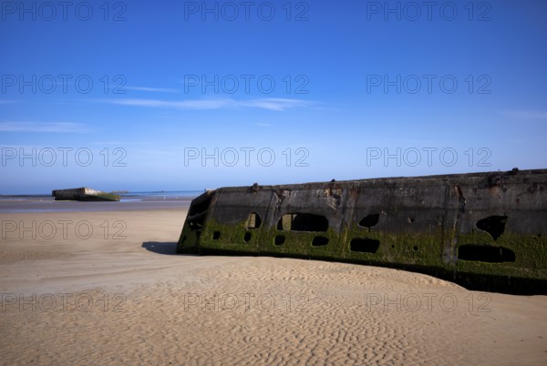 Phoenix Caissons, concrete boxes, caissons, were used in the sea as breakwaters and to form an improvised harbour, Mulberry B Harbour, Mulberry Harbour, Port Winston, Gold Beach, beach, D-Day, Operation Overlord, Arromanches-les-Bains, Normandy, Calvados, France