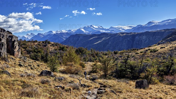 Picturesque mountain landscape with a hiker on a path under a clear sky, The landscape of Patagonia near El Chalten in Argentina
