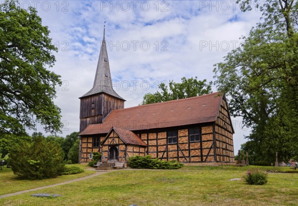 The Evangelical Lutheran St Peter's Church, the village church of Stuer in the Mecklenburg Lake District, is a half-timbered church with a half-timbered tower that is boarded up above the gabled roof of the nave. Stuer, Mecklenburg-Western Pomerania, Germany