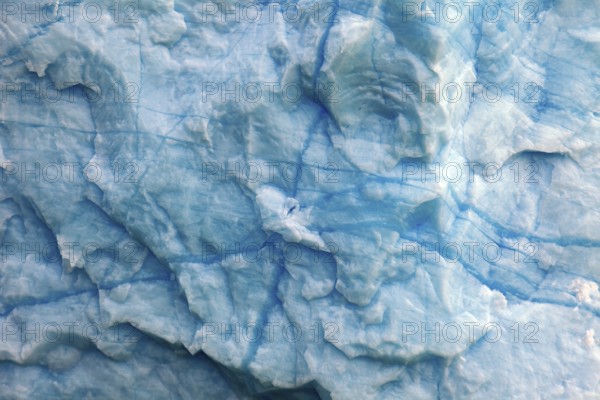 Close-up of the structured ice surface with blue cracks, The blue ice of the Perito Moreno Glacier in Patagonia Argentina