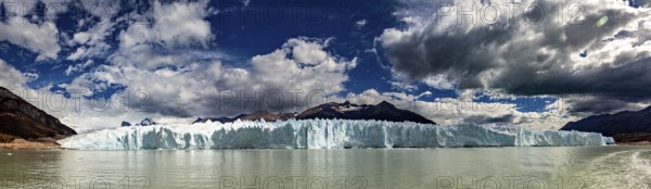 Idyllic panoramic view of a glacier and mountain range under a dynamic sky, The glacier of Perito Moreno in Argentina