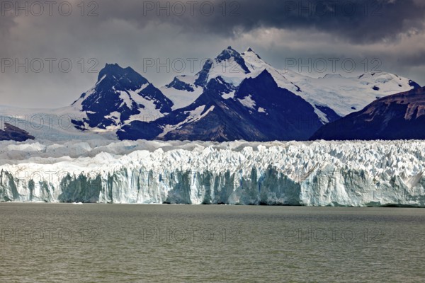 Majestic sight of mountains and glaciers under a gloomy sky, The Perito Moreno glacier in Argentina