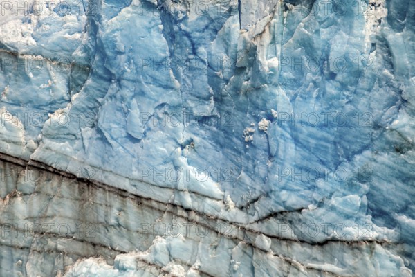 Close-up of blue ice surface with fine lines and natural patterns, The ice of the Perito Moreno glacier in Argentina