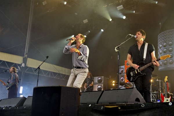 Marco Michael Wanda, singer, Manuel Christoph Poppe, guitarist, Reinhold Weber, bassist, from WANDA live on SCHÖN BEI DIR LIVE 2025-Tour at the Berlin Zitadelle on 12 July 2025