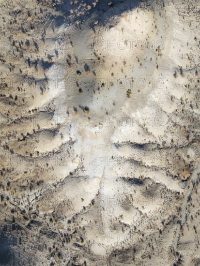 Broken, rocky ground with sparse vegetation. Aerial view. Drone shot. Southern Namibia