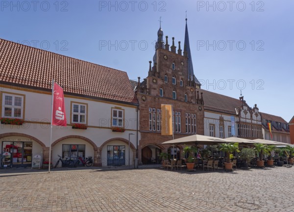 Restaurant in front of Lemgo's town hall, located on the market square. The town hall was built over several centuries from 1325 onwards in the Weser Renaissance style. It has been listed by UNESCO as an architectural monument worthy of protection. Lemgo, North Rhine-Westphalia, Germany