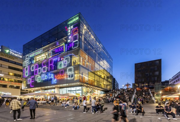 Stuttgart Art Museum in the evening with light installation and people on the steps. Long Night of the Museums in Stuttgart. Stuttgart, Baden-Württemberg, Germany