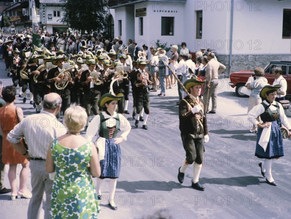 People in street procession through village of Oetz, Imst district, Tyrol, Austria, Europe, 1970
