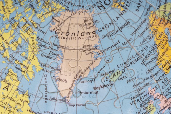 Puzzle globe. Map made from puzzle pieces. Greenland and Denmark