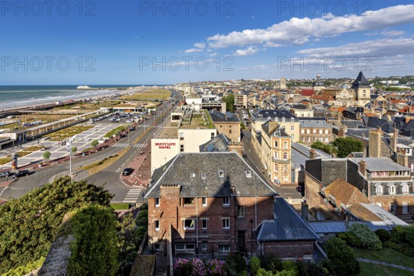 City panorama on the coast with promenade and historic buildings under a blue sky, The city of Dieppe in Normandy, France