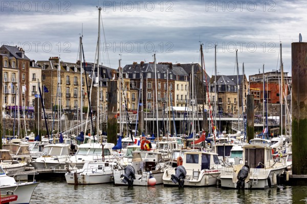 Lively harbour with numerous sailing and motor boats against a backdrop of historic buildings, the harbour of Dieppe in Normandy, France