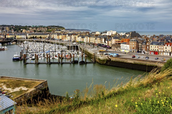 Panoramic view of a harbour and a town from a grassy hill, The harbour of Dieppe in Normandy, France