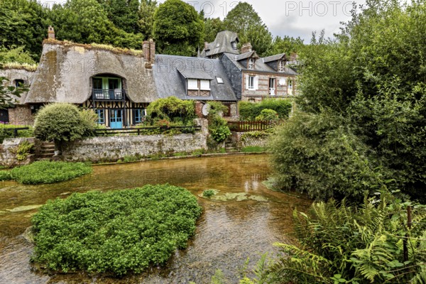Picturesque village on a river with half-timbered houses and lush nature, the historic mill village of Veules Les Roses in Normandy, France