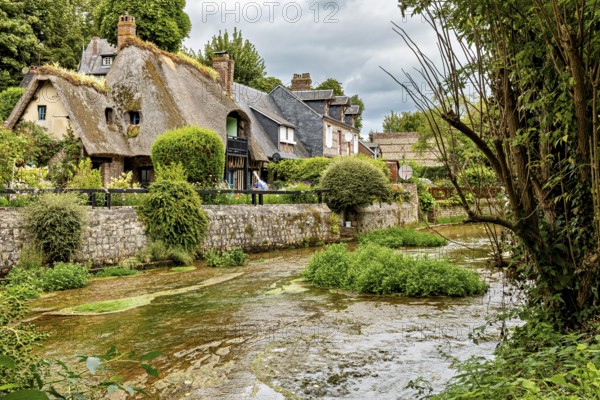 Charming cottage by a river with lush vegetation and historic flair, the historic mill village of Veules Les Roses in Normandy, France
