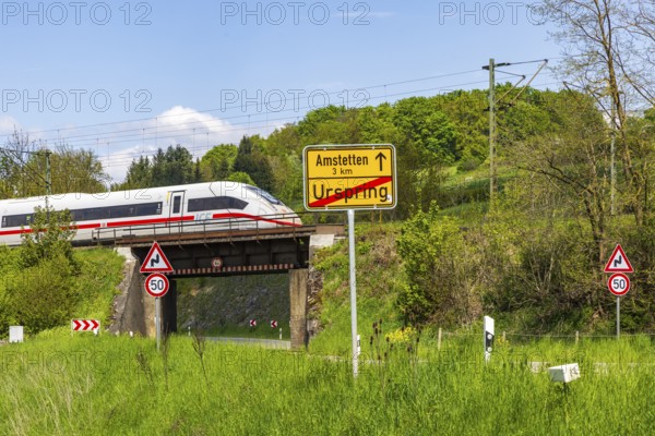InterCityExpress ICE en route on the Swabian Alb near Lonsee. Landscape with railway bridge near Urspring on the Filstalline railway line in spring. Lonsee, Baden-Württemberg, Germany