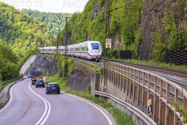 InterCityExpress ICE en route on the winding railway line of the Geislinger Steige. Landscape on the railway's Filstalline line in spring. Amstetten, Baden-Württemberg, Germany