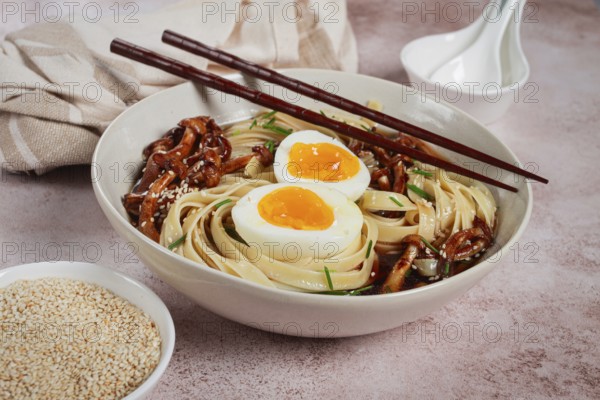 Buckwheat noodles soba with shimeji mushrooms, with boiled egg, green onion, sesame seeds, homemade, without people
