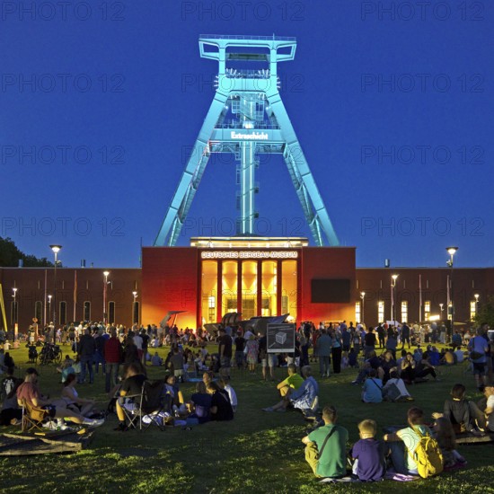People in front of the German Mining Museum for the Extra Shift at night, Bochum, Ruhr Area, North Rhine-Westphalia, Germany
