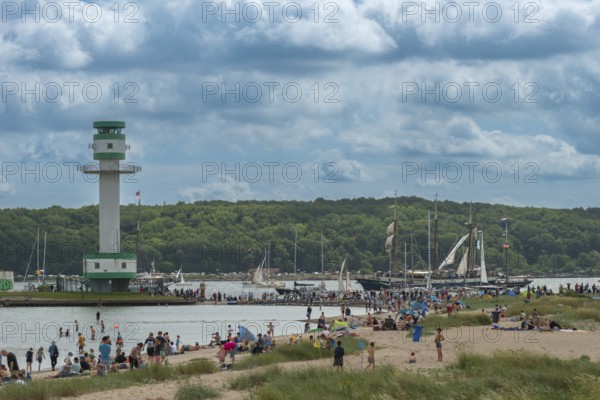 Windjammer Parade 2025 on the Kiel Fjord at the end of Kiel Week, tall ships, three-masters, spectators, Falkensteiner Strandleben, lighthouse, summer weather, sunshine, forest, Kiel, Schleswig-Holstein, Germany
