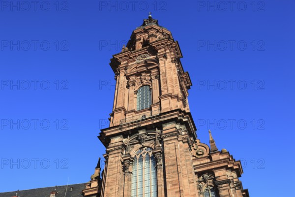 Tower of the new church. Today the building is used as an assembly hall and banqueting hall of the Julius Maximilian University, Würzburg, Lower Franconia, Bavaria, Germany