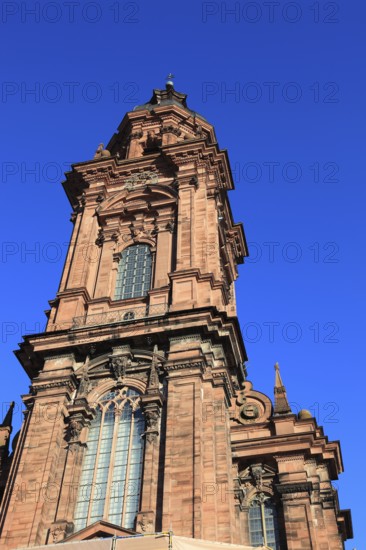 Tower of the new church. Today the building is used as an assembly hall and banqueting hall of the Julius Maximilian University, Würzburg, Lower Franconia, Bavaria, Germany