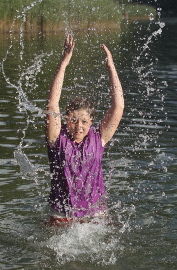 Girls splashing in the lake, Allgäu, Bavaria, Germany, Allgäu, Bavaria, Germany