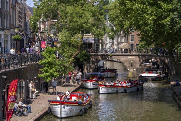 The old town centre of Utrecht, Oudegracht, around 2 km long with many old houses, shops, restaurants directly on the canal, many bridges, boat traffic of all kinds, canal cruise, Netherlands