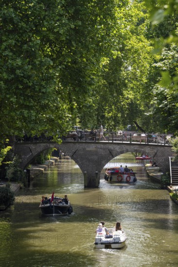 The old town centre of Utrecht, Oudegracht, around 2 km long with many old houses, shops, restaurants directly on the canal, many bridges, boat traffic of all kinds, Netherlands