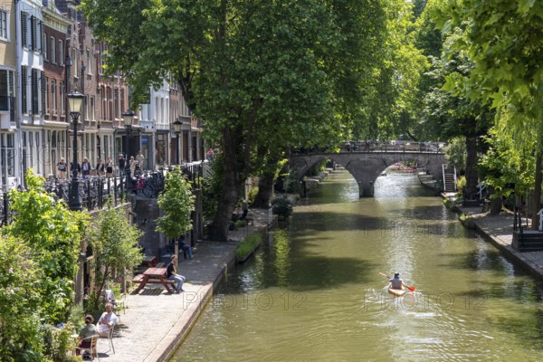 The old town centre of Utrecht, Oudegracht, around 2 km long with many old houses, shops, restaurants directly on the canal, many bridges, boat traffic of all kinds, Netherlands
