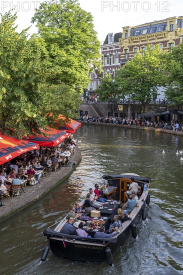 The old town centre of Utrecht, Oudegracht, around 2 km long with many old houses, shops, restaurants directly on the canal, many bridges, boat traffic of all kinds, canal cruise, Netherlands
