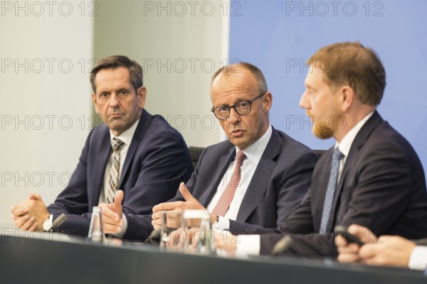 Olaf Lies (SPD, Minister President of Lower Saxony), Federal Chancellor Merz (CDU, Federal Chancellor) and Michael Kretschmer (CDU, Minister President of the Free State of Saxony) during a press conference after the consultation between Federal Chancellor Friedrich Merz and the heads of government of the federal states in the Federal Chancellery, Berlin, 18 June 2025