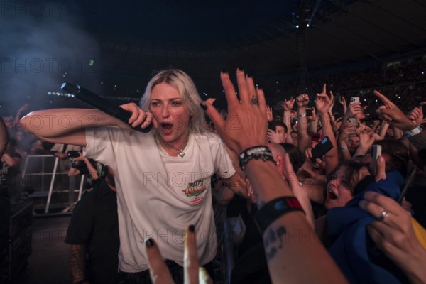 Emily Armstrong, lead singer of Linkin Park in the photo pit between the audience live on From Zero World Tour 2025 at the Olympiastadion Berlin on 18 June 2025