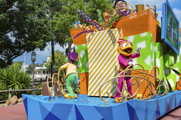 Disney character riding on float during parade through the Frontierland area of Magic Kingdom at Walt Disney World, Orlando, Florida