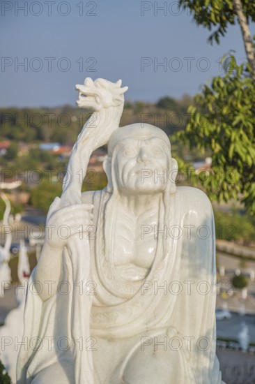 Statues around the perimeter of the Guan Yin (Goddess of Mercy) statue at Wat Huay Pla Kang Temple in Chiang Rai province of Northern Thailand