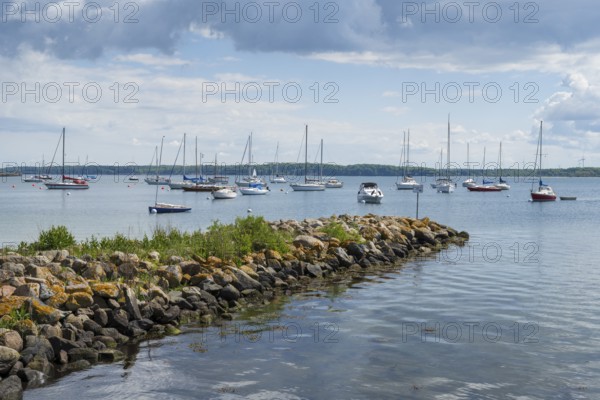 Sailing boats in the harbour, stone jetty, dark clouds, Eckernförde, Baltic Sea, Schleswig-Holstein, Germany