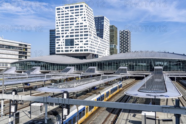 Utrecht Centraal railway station, tracks and concourse, trains of Nederlandse Spoorwegen N.V. state railway company, office building in the city centre, Netherlands
