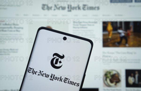Dhaka, Bangladesh - 18 March 2025: The logo of the the new york times is displayed on a smartphone screen, and the website the new york times is visible on a computer screen in the background