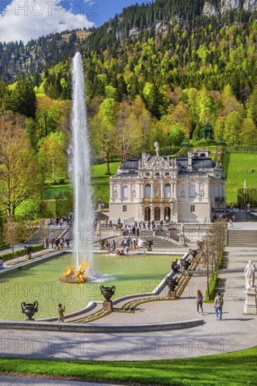 Water parterre with large fountain and portal of Linderhof Castle in spring, municipality of Ettal, Ammergau Alps, Ammertal, Upper Bavaria, Bavaria, Germany